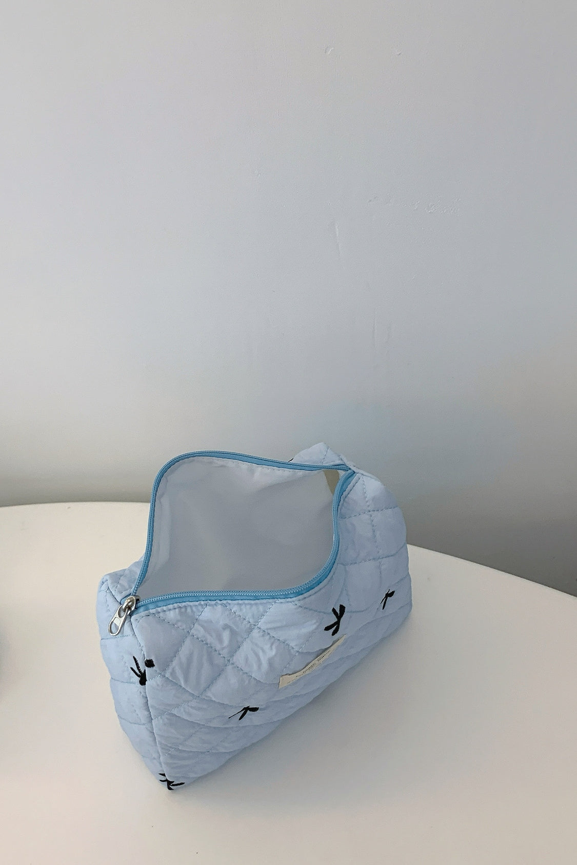 Bow Embroidered Quilted Storage Bag - The Daily Makeover